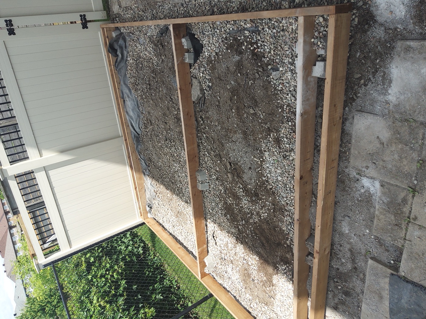 Wood framing in progress for an outdoor deck platform